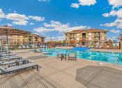 Thumbnail 30 of 45 - RedPoint Apartments Pool with Lounge Chairs