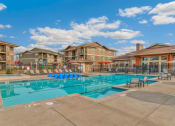 Thumbnail 31 of 45 - RedPoint Apartments Pool with Lounge Chairs