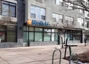 Thumbnail 14 of 15 - the front of a building with a parking meter in front of it