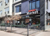 Thumbnail 13 of 15 - the exterior of a store with a gate in front of it