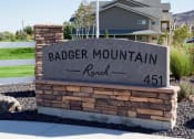 Thumbnail 44 of 45 - Badger Mountain Ranch monument sign in front of leasing office