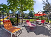 Thumbnail 8 of 20 - Saratoga Apartments in Everett, Washington Patio with Lounge Chairs