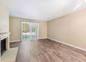 Thumbnail 10 of 20 - Saratoga Apartments in Everett, Washington Living Room with Fireplace and Private Patio