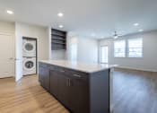 Thumbnail 7 of 30 - a laundry room with a washer and dryer in a new home
