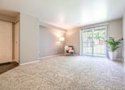 Thumbnail 13 of 16 - A room with a carpet floor and a window with blinds.