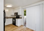 Thumbnail 10 of 34 - Sugar Pine Townhomes in Boise, Idaho Dining Room and Kitchen with Private Patio