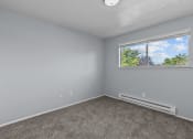 Thumbnail 6 of 34 - an empty room with carpet and a window