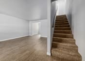 Thumbnail 4 of 8 - North River Apartments Living room and stairs