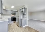 Thumbnail 7 of 19 - The Acres Model Kitchen and Living Room