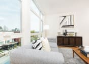 Thumbnail 9 of 36 - The Hayes on Stone Way Apartments living room with large windows at The Hayes on Stone Way, Seattle