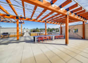 Thumbnail 20 of 36 - The Hayes on Stone Way Apartments roof terrace with grills at The Hayes on Stone Way, Seattle