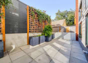 Thumbnail 25 of 36 - small patio with a fence and plants at The Hayes on Stone Way, Washington