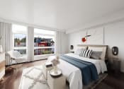 Thumbnail 3 of 36 - a bedroom with a bed and a large window at The Hayes on Stone Way, Seattle, Washington