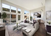 Thumbnail 6 of 36 - The Hayes on Stone Way Apartments  living room with a couch and a coffee table and large windows at The Hayes on Stone Way, Seattle, WA
