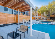 Thumbnail 12 of 18 - The Monet Apartments in Dallas, Texas Pool with Lounge Chairs