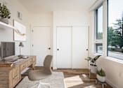 Thumbnail 26 of 30 - The Wes Gresham Oregon Apartments A room with a desk, chair, and a window.