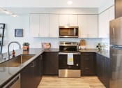Thumbnail 6 of 29 - Geo Apartments Model Kitchen