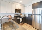 Thumbnail 5 of 29 - Geo Apartments Model Kitchen