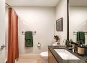 Thumbnail 8 of 48 - a bathroom with a toilet sink and shower