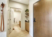 Thumbnail 7 of 48 - a hallway with wooden floors and a wooden door