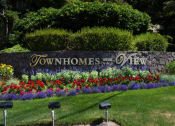 Thumbnail 1 of 26 - Townhomes with a View Exterior Monument Sign and Landscaping