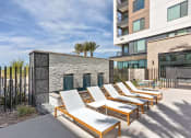 Thumbnail 27 of 35 - Trovita Rio Apartments in Tempe, Arizona Poolside Lounge Chairs