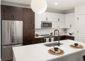 Thumbnail 3 of 35 - Trovita Rio Apartments in Tempe, Arizona Model Kitchen with Island