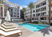 Thumbnail 25 of 35 - Trovita Rio Apartments in Tempe, Arizona Pool with Lounge Chairs