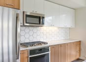 Thumbnail 3 of 26 - Multnomah Station Apartments refrigerator, range, microwave