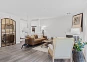 Thumbnail 4 of 43 - a living room with white walls and hardwood floors