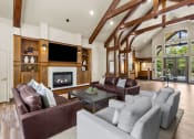 Thumbnail 21 of 43 - a living room filled with furniture and a fireplace