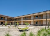 Thumbnail 27 of 30 - Villa Cielo Cortaro Apartments in Tucson, Arizona Exterior and Hammock Courtyard