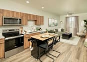 Thumbnail 1 of 30 - Villa Cielo Cortaro Apartments in Tucson, Arizona Model Kitchen with Island