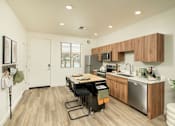 Thumbnail 2 of 30 - Villa Cielo Cortaro Apartments in Tucson, Arizona Model Kitchen with Island