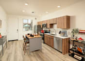 Thumbnail 13 of 30 - Villa Cielo Cortaro Apartments in Tucson, Arizona Model Kitchen with Island