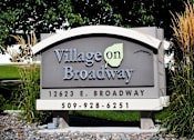 Thumbnail 20 of 20 - Village on Broadway Apartments in Spokane Valley, Washington Monument Sign