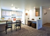 Thumbnail 2 of 20 - Village on Broadway Apartments in Spokane Valley, Washington Model Kitchen with Built-In Desk