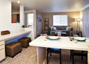 Thumbnail 3 of 20 - Village on Broadway Apartments in Spokane Valley, Washington Model Kitchen with Built-In Desk