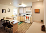 Thumbnail 1 of 20 - Village on Broadway Apartments in Spokane Valley, Washington Model Kitchen