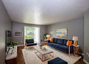Thumbnail 10 of 12 - a living room with blue couches and chairs and a rug