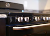 Thumbnail 9 of 27 - a close up of a stove top oven in a kitchen at Urban Square, Denton, TX, 76210