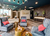 Thumbnail 21 of 27 - A living room with a blue chair and a gold coffee table. at 985 High Apartments, Columbus, OH, 43201