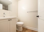 Thumbnail 12 of 20 - an empty bathroom with a toilet and a sink