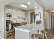Thumbnail 10 of 66 - Eat-In Kitchen Breakfast Bar at CityView on Meridian, Indianapolis, Indiana
