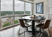Thumbnail 5 of 66 - Cozy dining room with large windows and view of the city at CityView on Meridian, Indianapolis, IN,46208