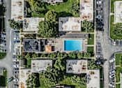 Thumbnail 38 of 38 - A bird's eye view of a residential area with a swimming pool.