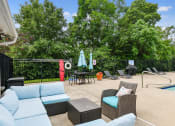Thumbnail 26 of 39 - Grilling and lounge area by the poolside at Heritage Hill Estates Apartments, Cincinnati, Ohio 45227