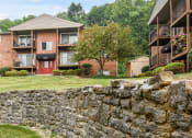 Thumbnail 34 of 39 - Stone wall outside in the spacious lawn at Heritage Hill Estates Apartments, Cincinnati, Ohio 45227