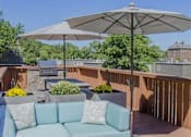 Thumbnail 17 of 25 - Patio with large comfortable couch at Lexington Square, Lexington, KY