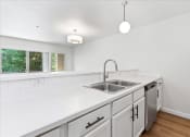 Thumbnail 10 of 48 - Kitchen white counter top at River Walk Apartments, Boise, 83702